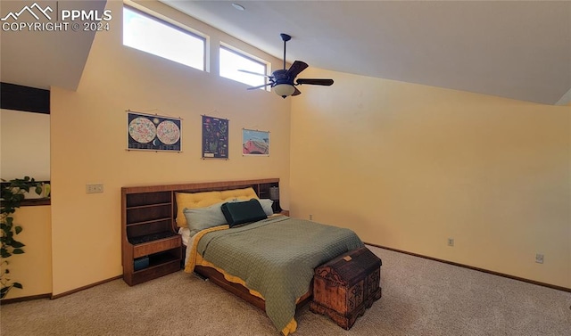 carpeted bedroom featuring high vaulted ceiling and ceiling fan