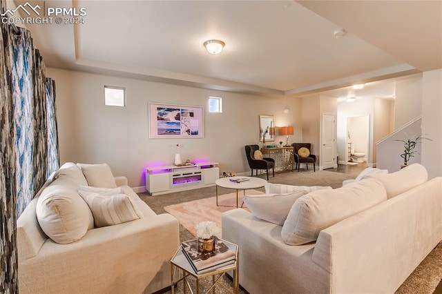 living room featuring carpet floors and indoor bar