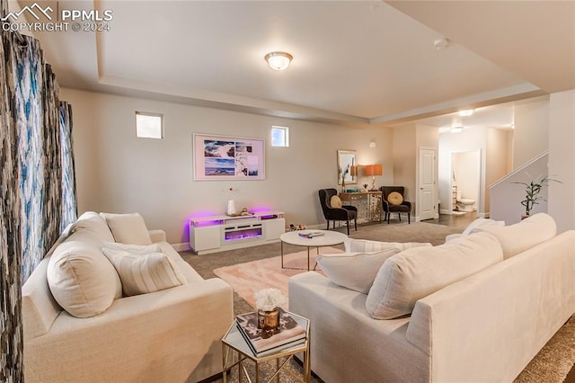 carpeted living room with bar area