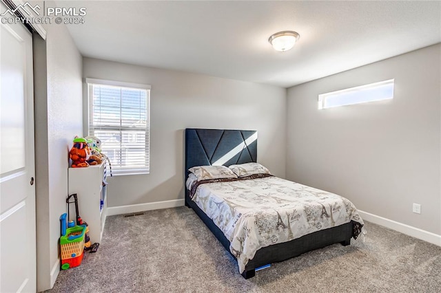 bedroom with light carpet