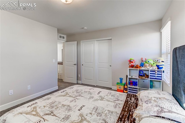 carpeted bedroom featuring a closet