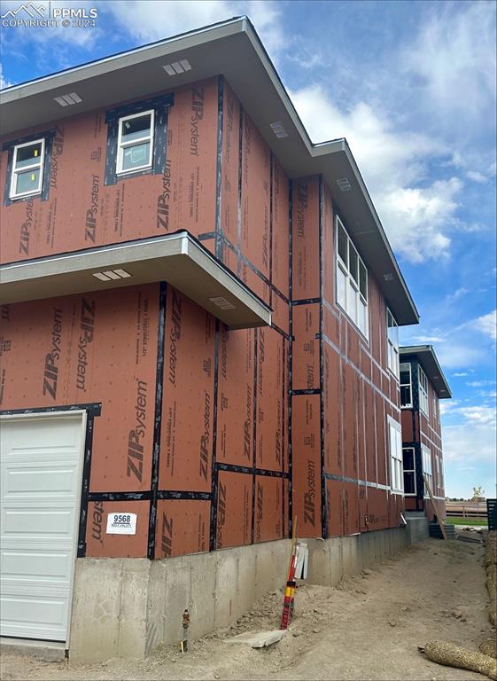 view of side of property featuring a garage