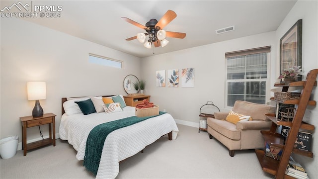 carpeted bedroom with ceiling fan