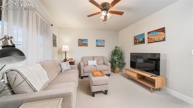 living room with carpet and ceiling fan