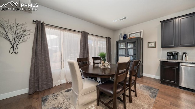 dining area with dark wood-type flooring