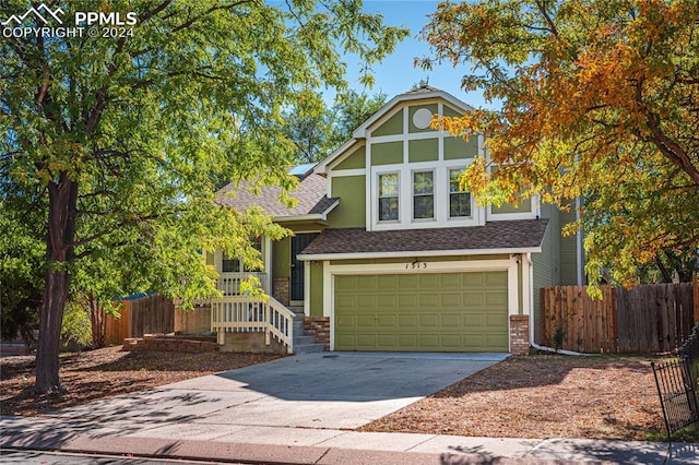 english style home with a garage