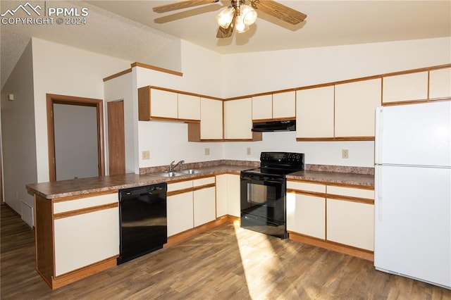 kitchen featuring hardwood / wood-style flooring, kitchen peninsula, black appliances, vaulted ceiling, and white cabinets