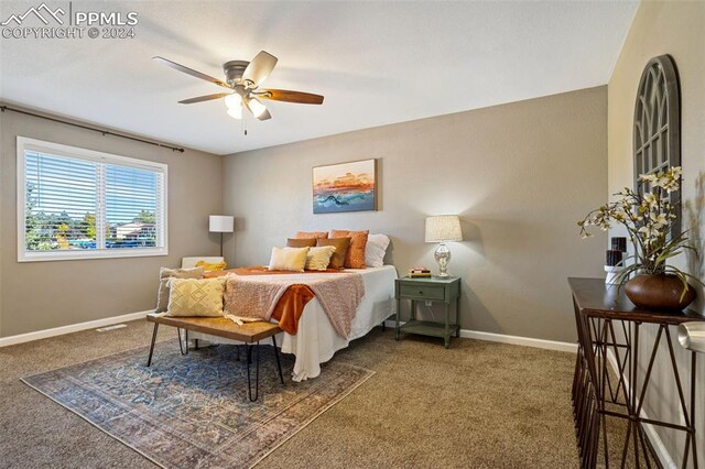 carpeted bedroom featuring ceiling fan