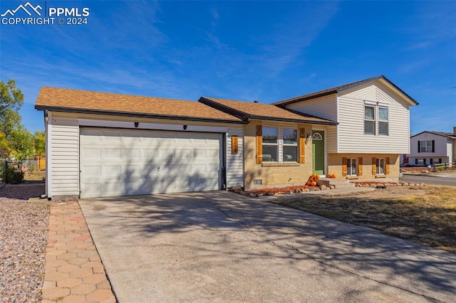 split level home with a garage