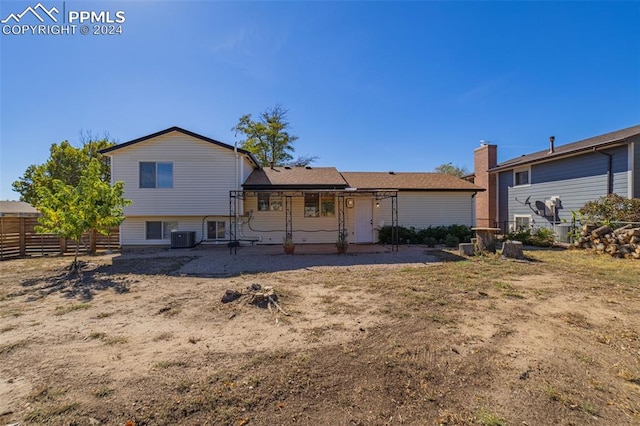 view of front of house with a patio and central AC unit