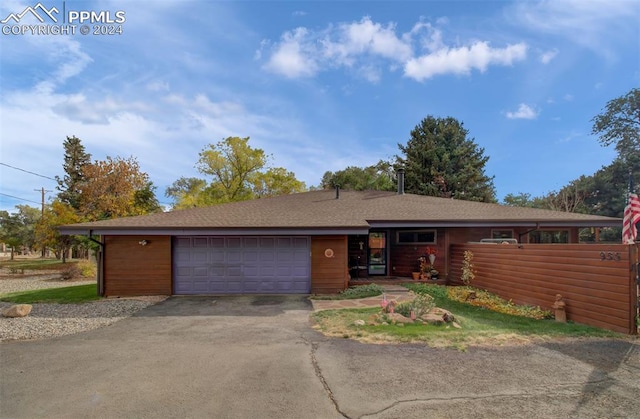 single story home featuring a garage