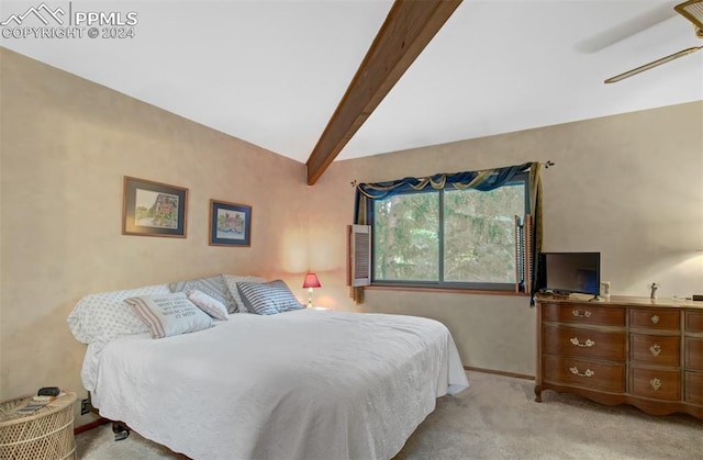 bedroom featuring light colored carpet and vaulted ceiling with beams