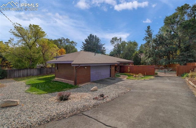 view of property exterior with a garage