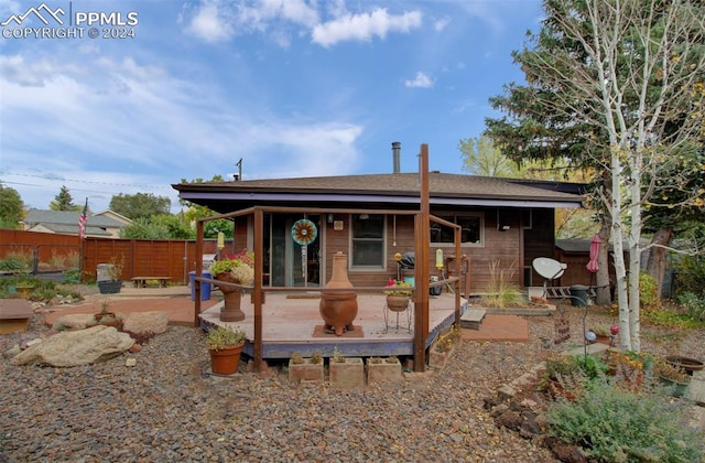 rear view of house with a deck