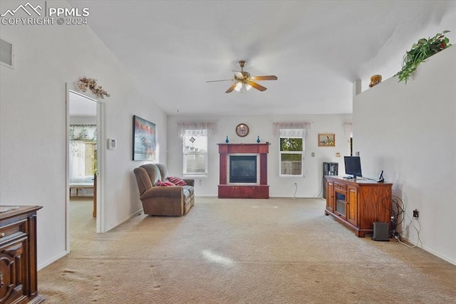 living room featuring light colored carpet and ceiling fan