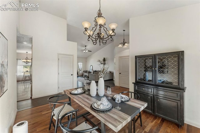 dining room featuring dark wood-type flooring, high vaulted ceiling, and ceiling fan with notable chandelier