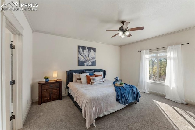 bedroom featuring ceiling fan, crown molding, and carpet