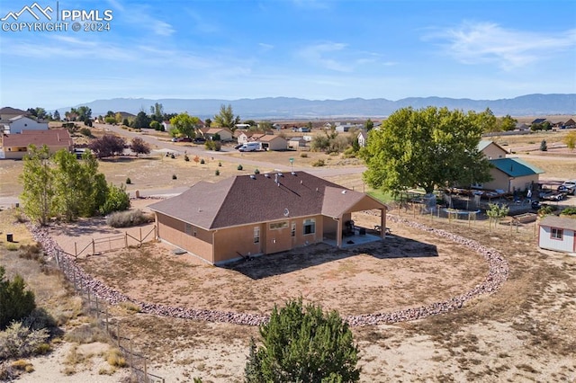 drone / aerial view featuring a mountain view