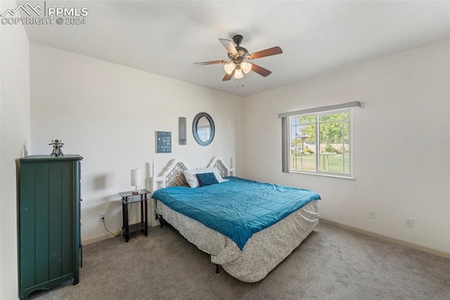 bedroom with ceiling fan and carpet flooring