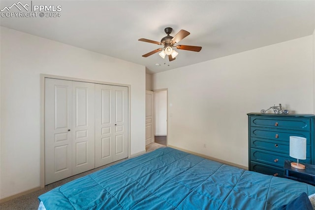 bedroom featuring light carpet, a closet, and ceiling fan