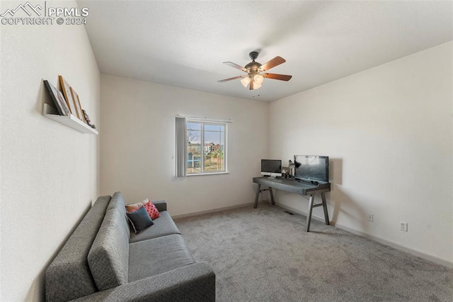 office area with carpet and ceiling fan