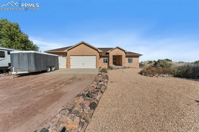 ranch-style house featuring a garage