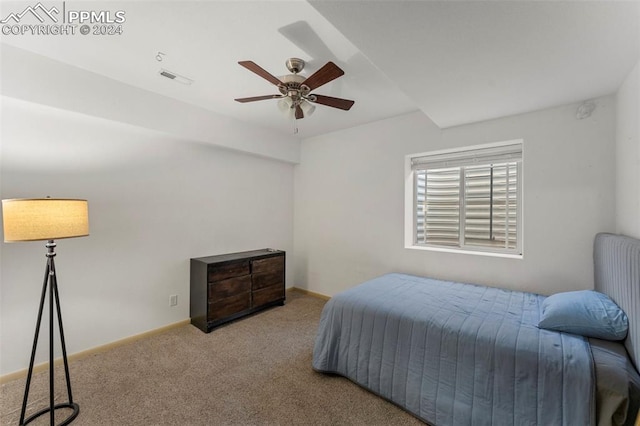 bedroom with ceiling fan and light colored carpet