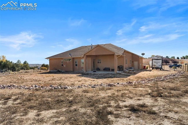 rear view of property with a patio area