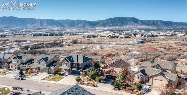 drone / aerial view featuring a mountain view