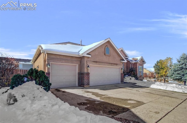 single story home with a garage