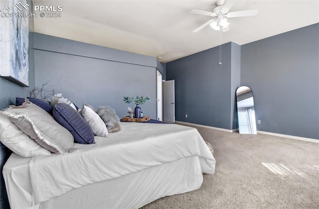 bedroom with ceiling fan and carpet floors