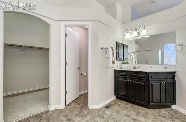 bathroom with vanity and an enclosed shower