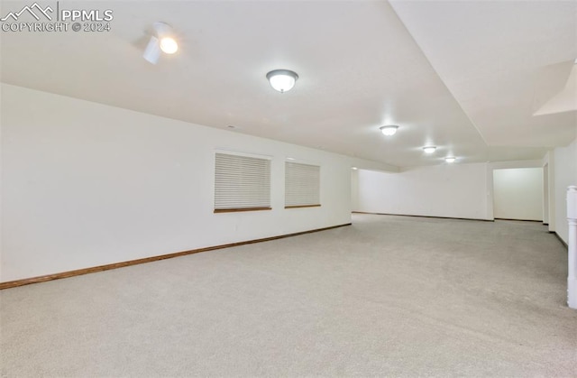 basement with light colored carpet