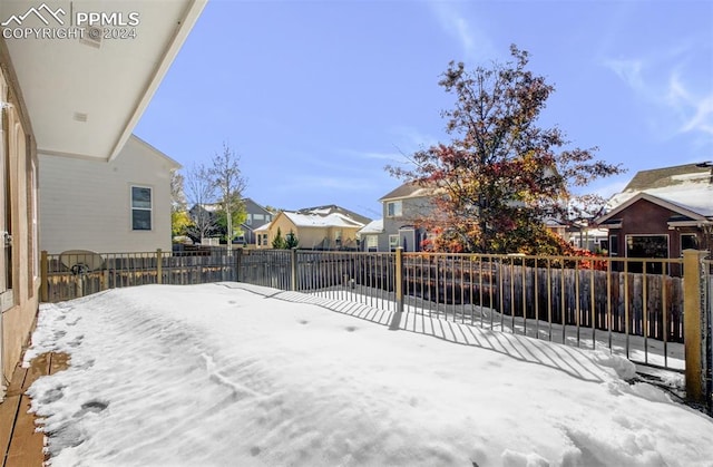 view of yard layered in snow