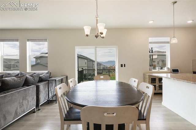 dining room featuring a notable chandelier and hardwood / wood-style flooring