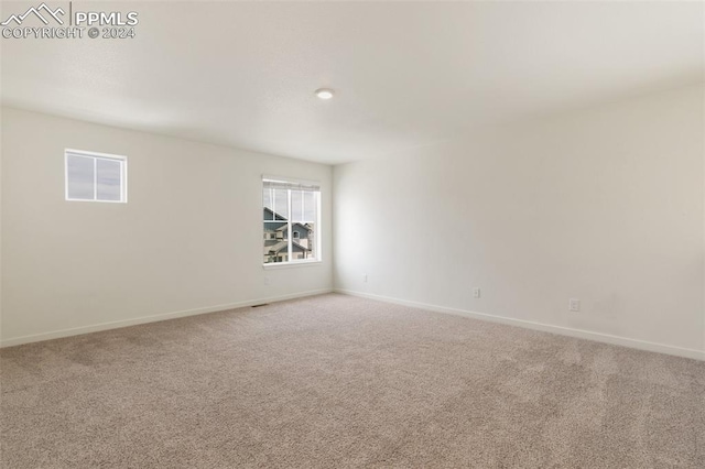 unfurnished room with carpet