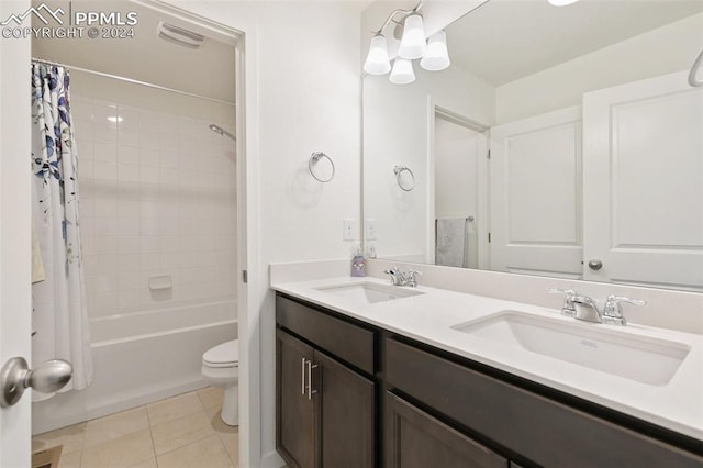 full bathroom featuring vanity, shower / bath combination with curtain, toilet, and tile patterned floors