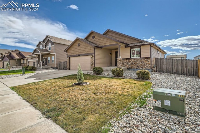 craftsman-style house featuring a front yard and a garage