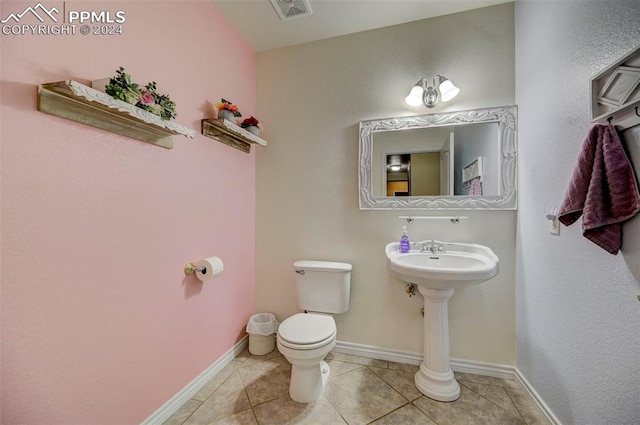 bathroom with tile patterned floors and toilet