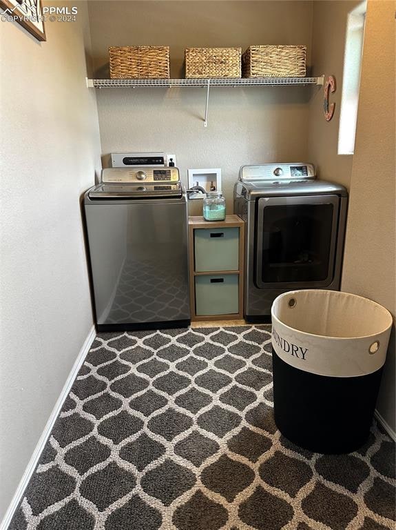 washroom with independent washer and dryer and carpet