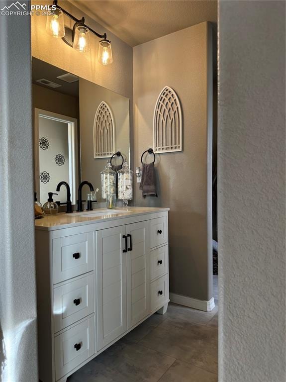 bar featuring white cabinets, sink, and tile patterned flooring