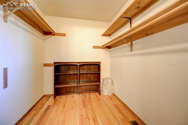 walk in closet featuring light hardwood / wood-style floors