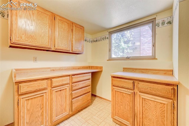 kitchen featuring light brown cabinetry