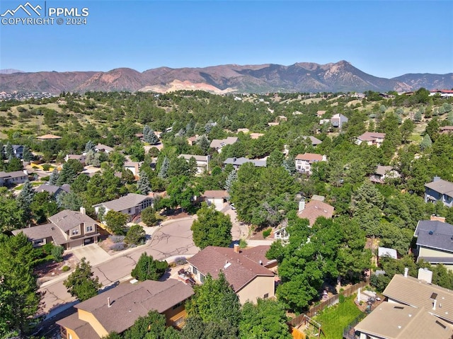 birds eye view of property with a mountain view