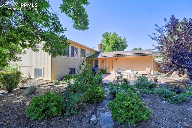 back of house featuring a patio area