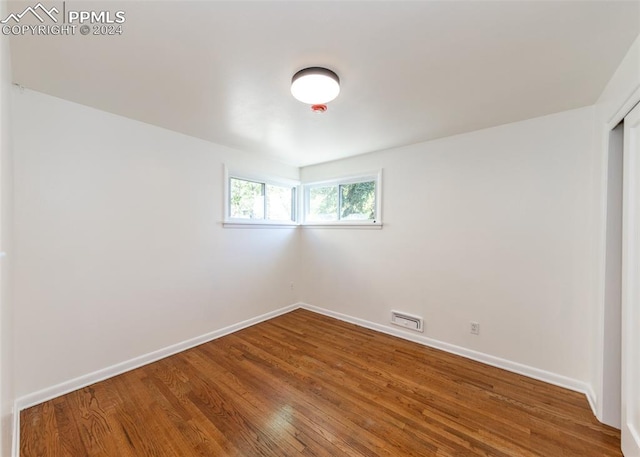 empty room featuring hardwood / wood-style flooring