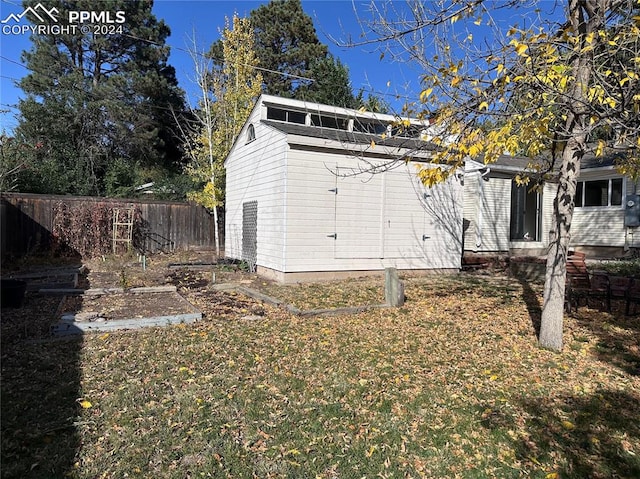 view of side of home featuring a lawn