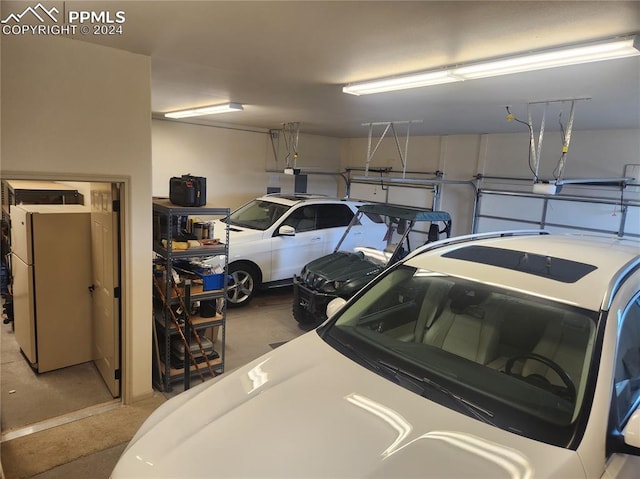 garage with white refrigerator