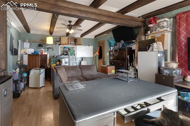 kitchen featuring beamed ceiling, light wood-type flooring, and ceiling fan