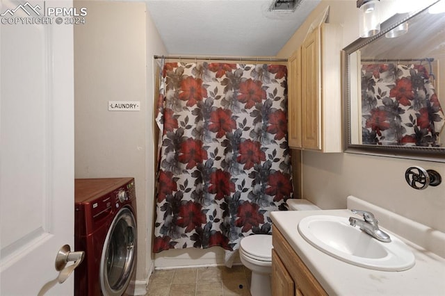 bathroom featuring washer / dryer, toilet, vanity, a shower with shower curtain, and tile patterned flooring